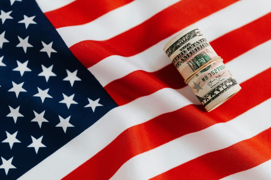 A bundle of Note is on the flag of USA representing Quick Business Loan