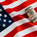 A bundle of Note is on the flag of USA representing Quick Business Loan